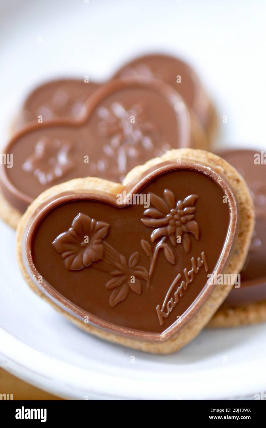 Chocolate biscuit with alpine flower motif - Stock Photo
