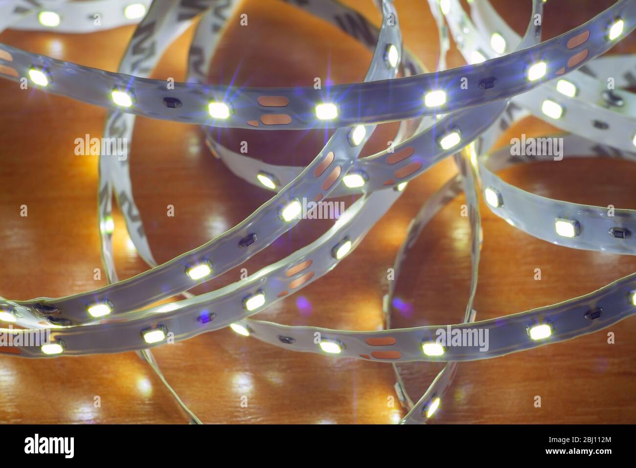 LED strip on a wooden table, close-up Stock Photo