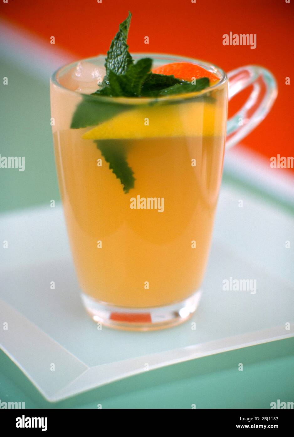 Glass mug of minted lemon drink - Stock Photo
