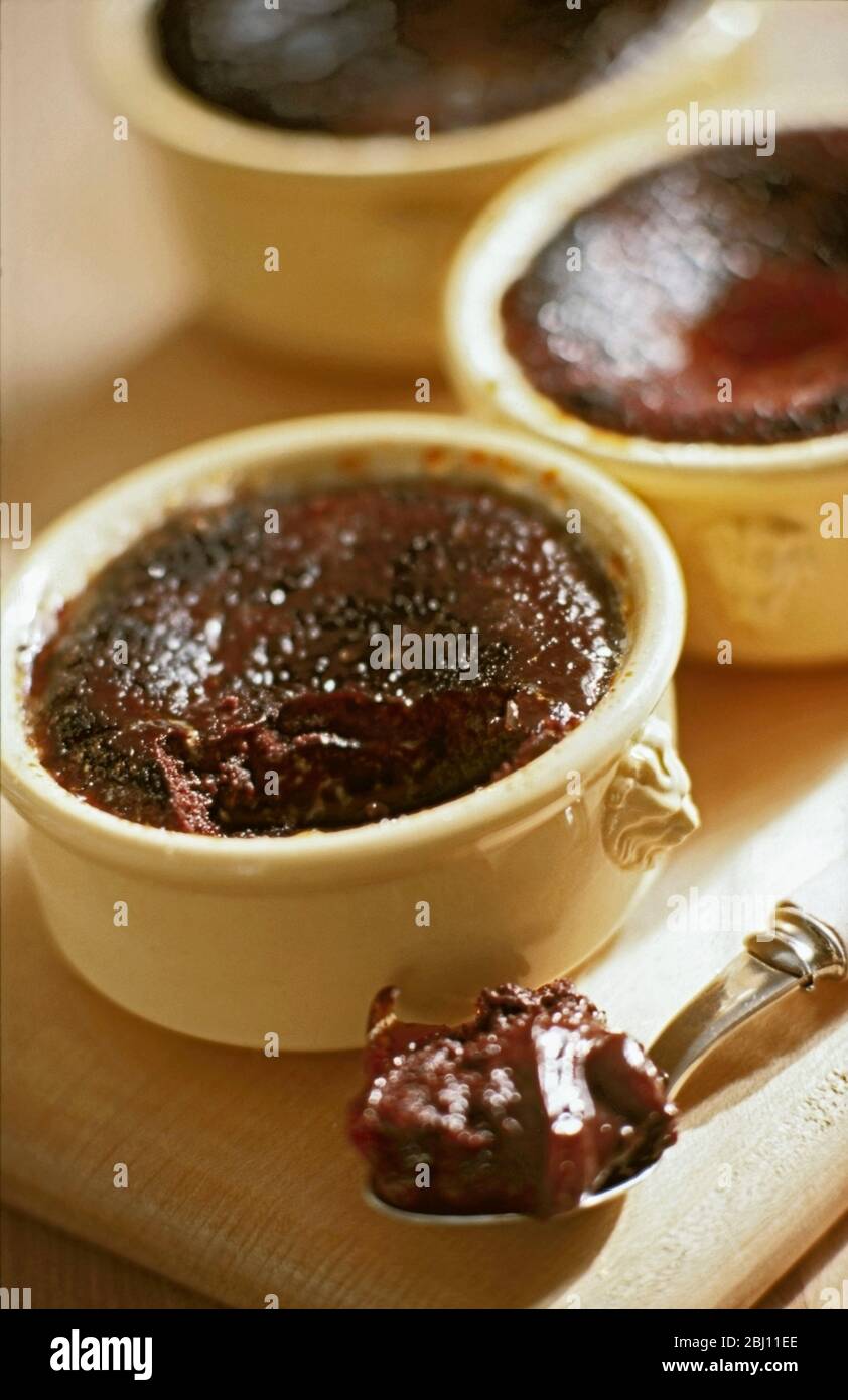 Hot baked chocolate puddings - Stock Photo