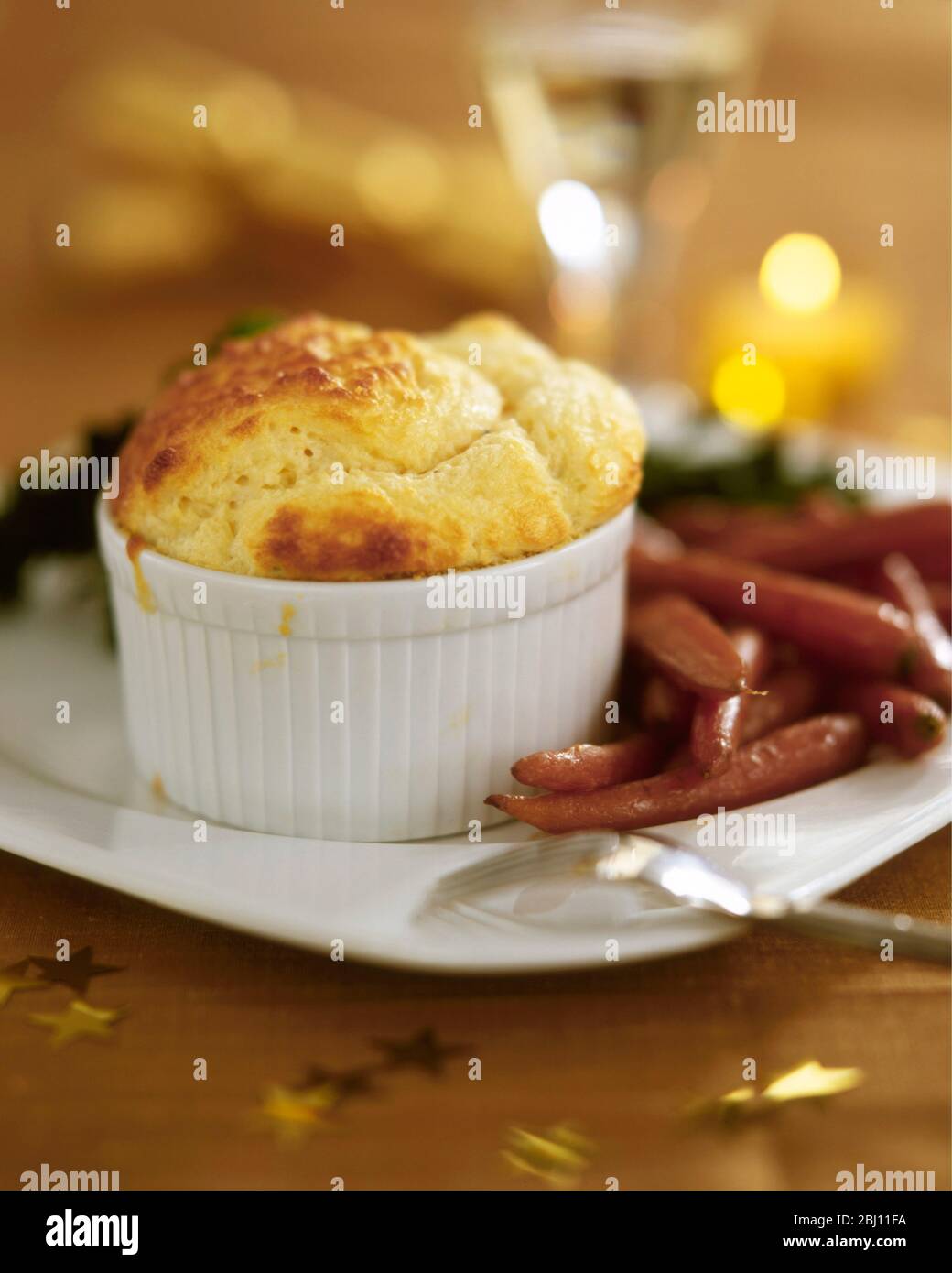 Individual cheese souffle with roast vegetables as Christmas meal alternative - - Stock Photo