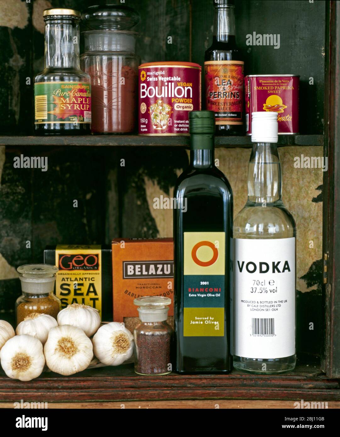 Old store cupboard with selection of food products - Stock Photo