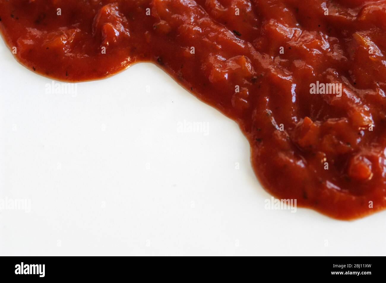 Italian tomato passata on white background - Stock Photo