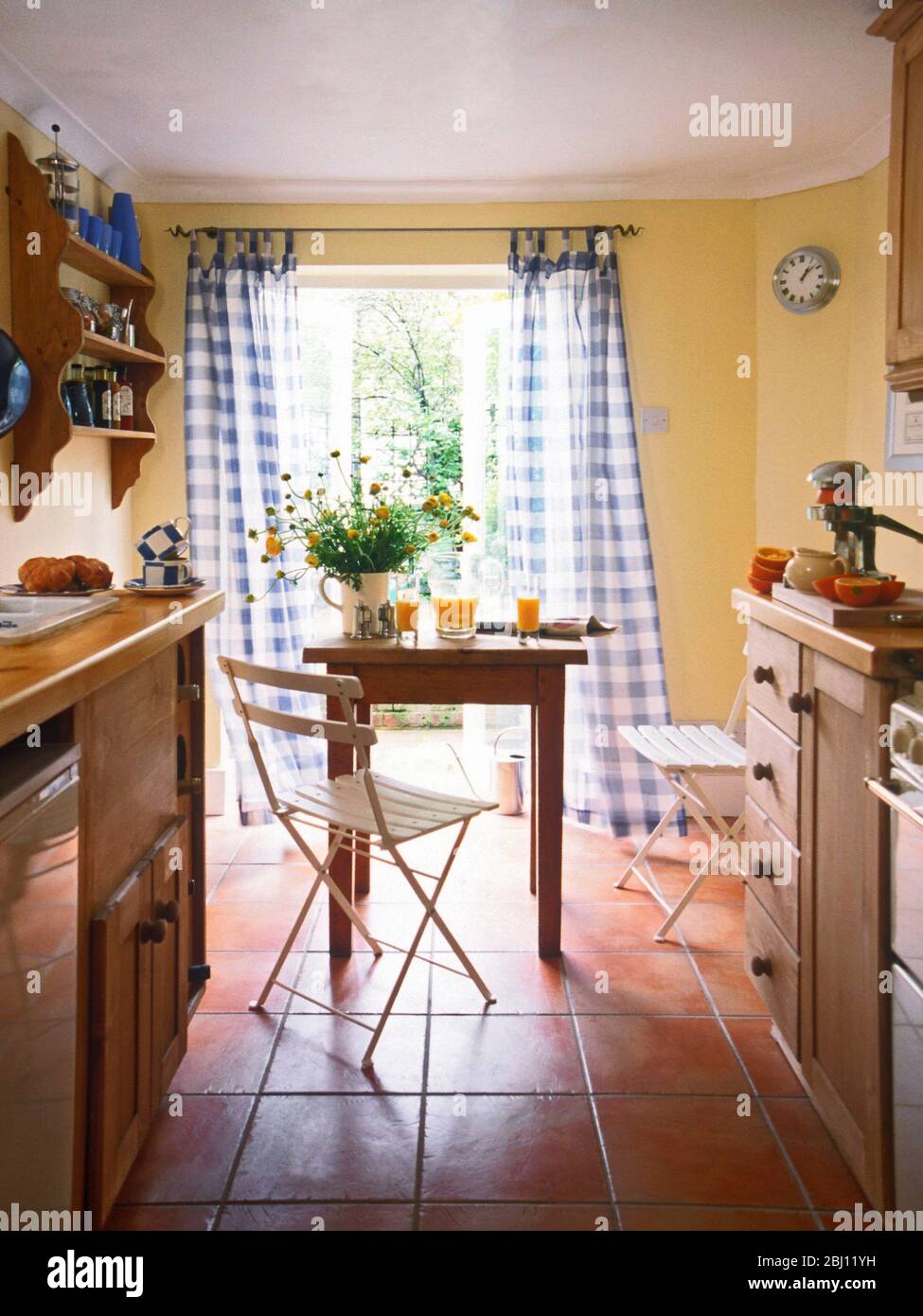 Interior of small kitchen of terraced house attractively decorated - Stock Photo