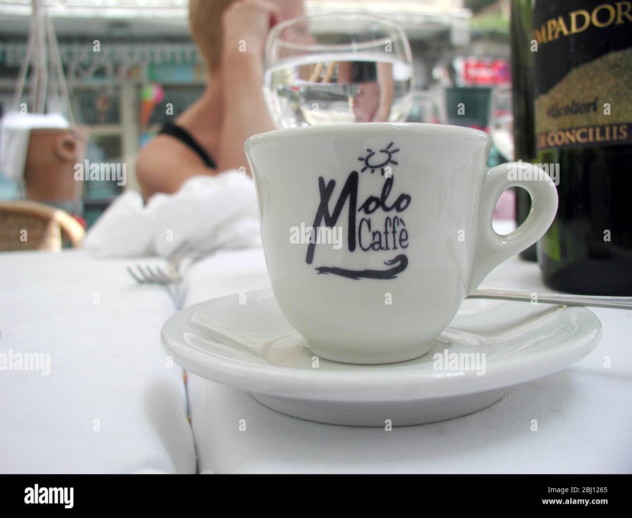 Cup of espresso coffee on table of Italian street cafe in Amalfi. - Stock Photo