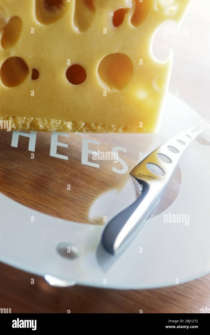 Modern cheeseeboard with selection of cheeses - Stock Photo