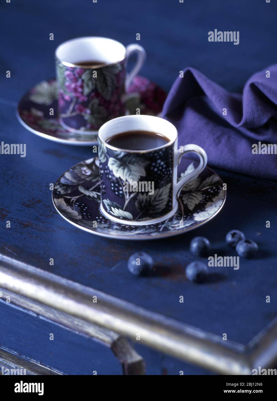 Coffee cups and blueberries - Stock Photo