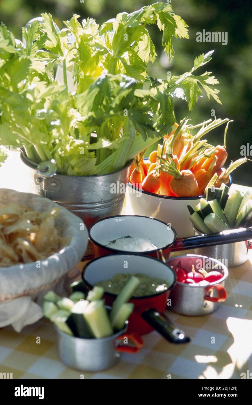 Salad ingredients on table outdoors - Stock Photo