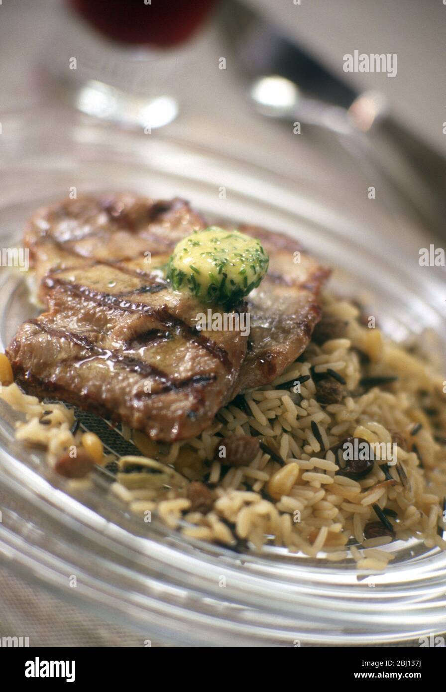 Escalopes on rice - Stock Photo