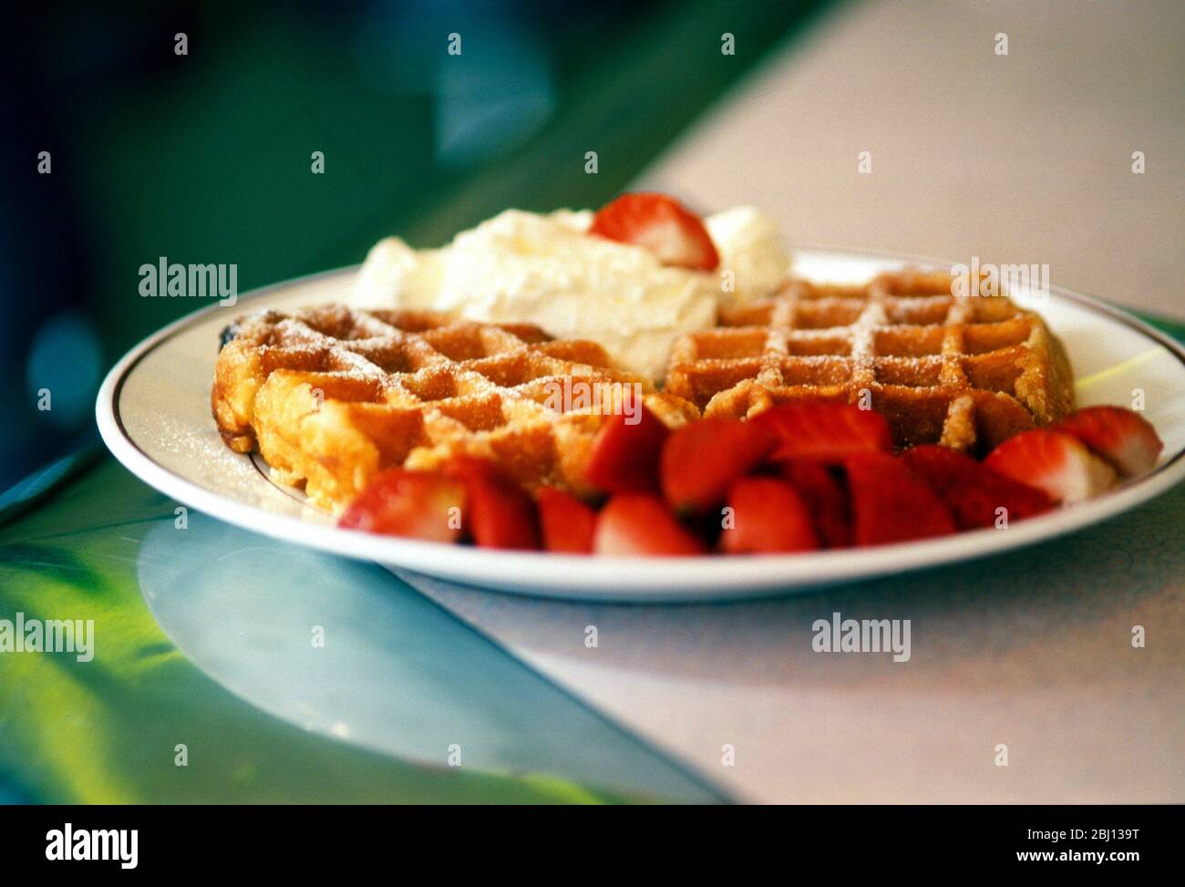 Waffles with strawberries and cream - Stock Photo