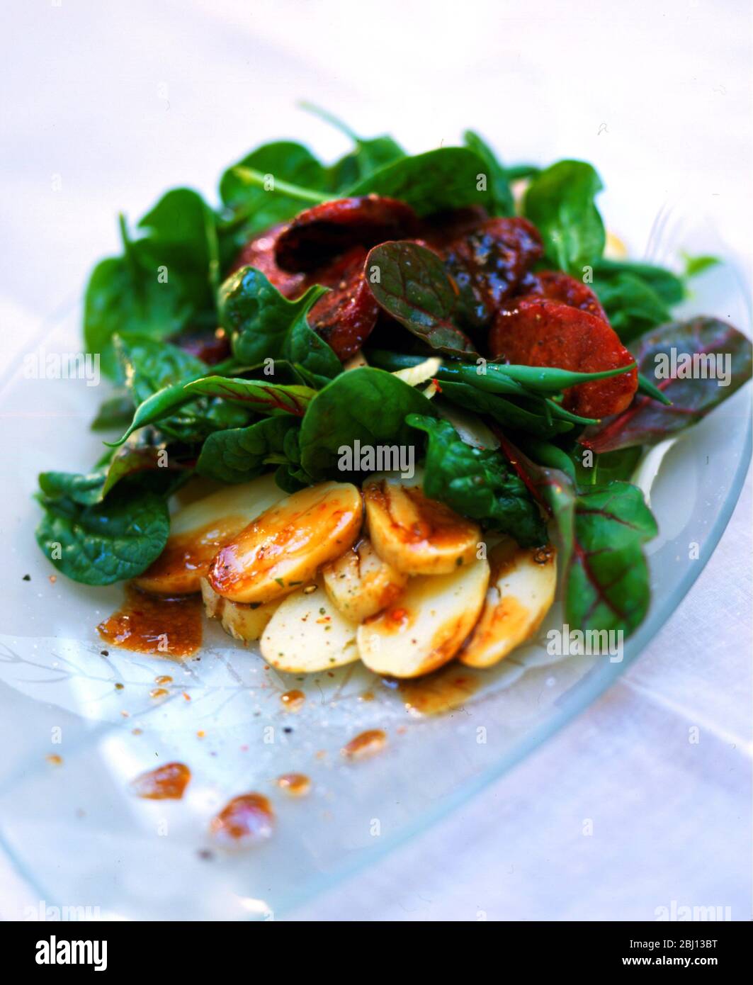 Spinach and potato salad - Stock Photo