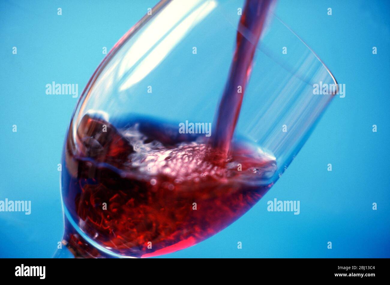 Pouring red wine - Stock Photo