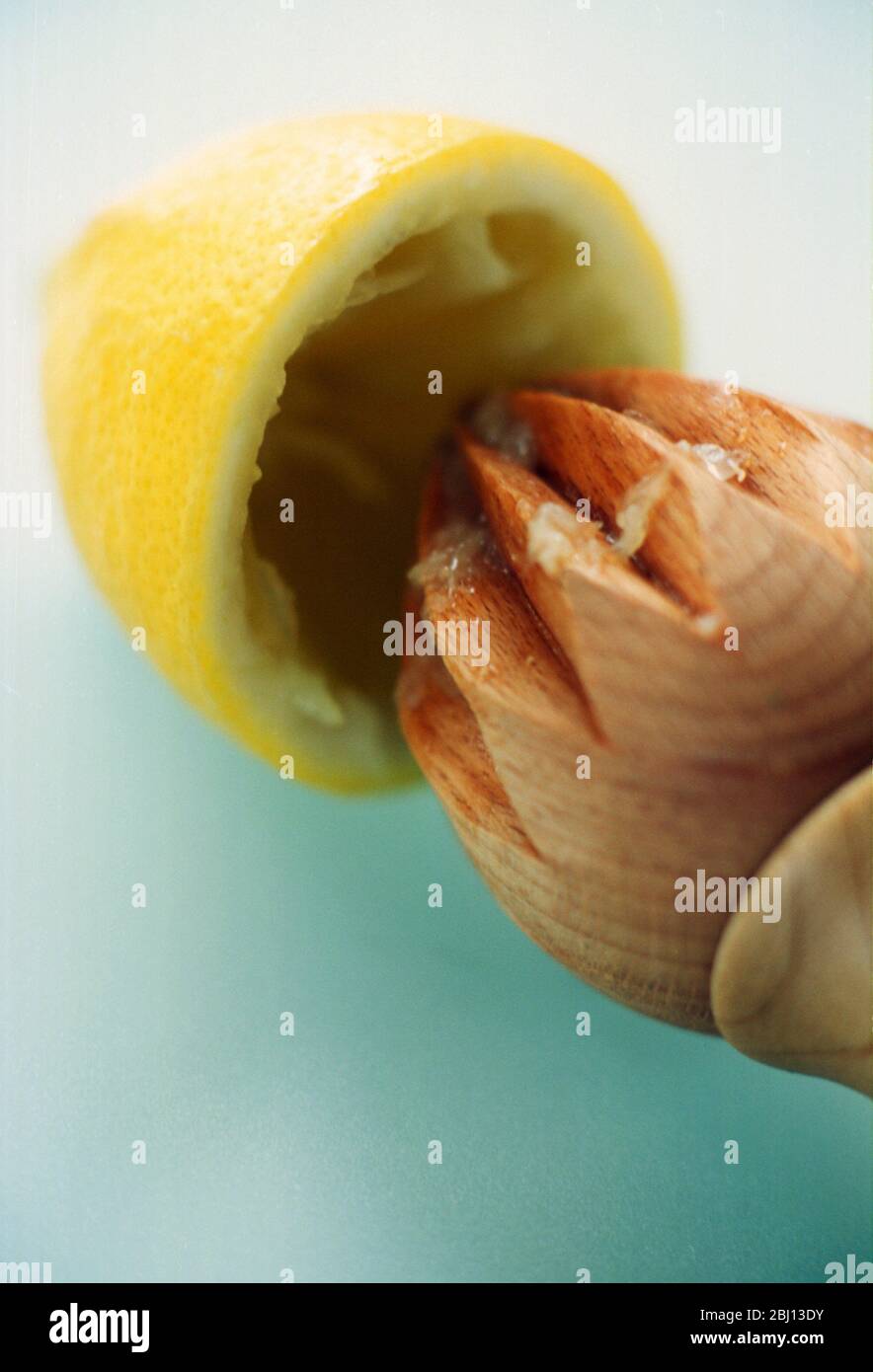 Lemon and squeezer Stock Photo - Alamy
