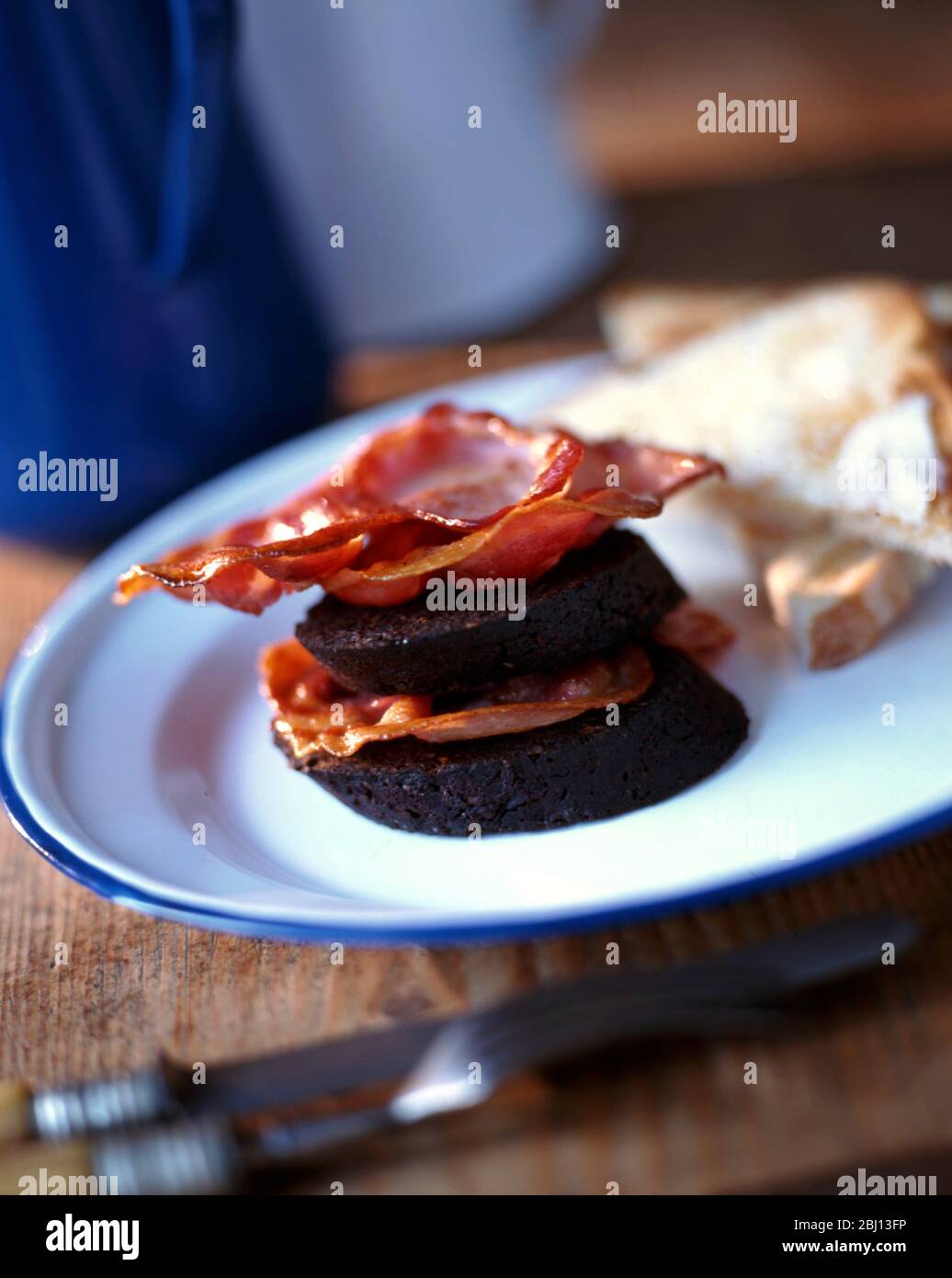 Black pudding and bacon tower - Stock Photo