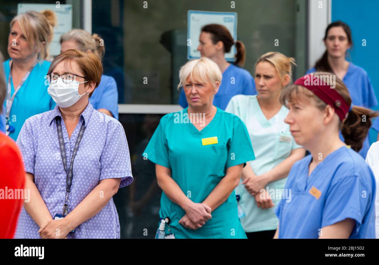 Harrogate, North Yorkshire, UK. 28th Apr, 2020. Doctors, nurses and all NHS keyworkers outside Harrogate District Hospital to honour their colleagues who lost their lives to Covid 19 observing one minute of silence. Credit: ernesto rogata/Alamy Live News Stock Photo