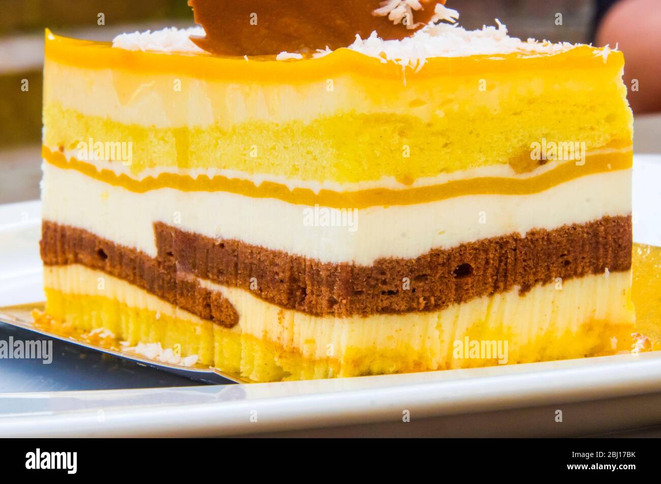 Chocolate Parfait Sponge Cake Cream And Mango With A Milk Chocolate Hedgehog Decoration Stock Photo Alamy