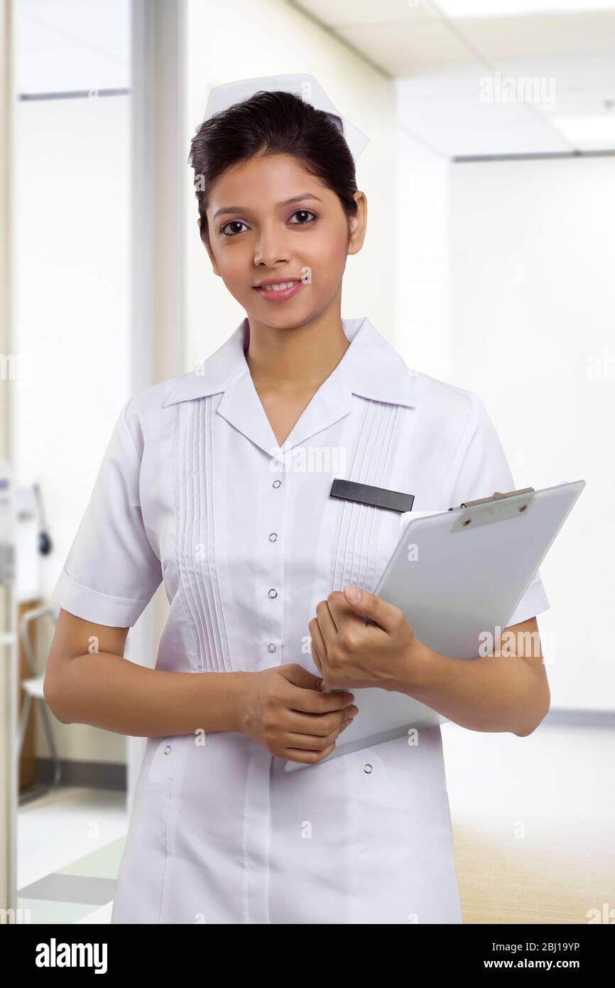 Portrait of a nurse with a clipboard in hospital Stock Photo - Alamy