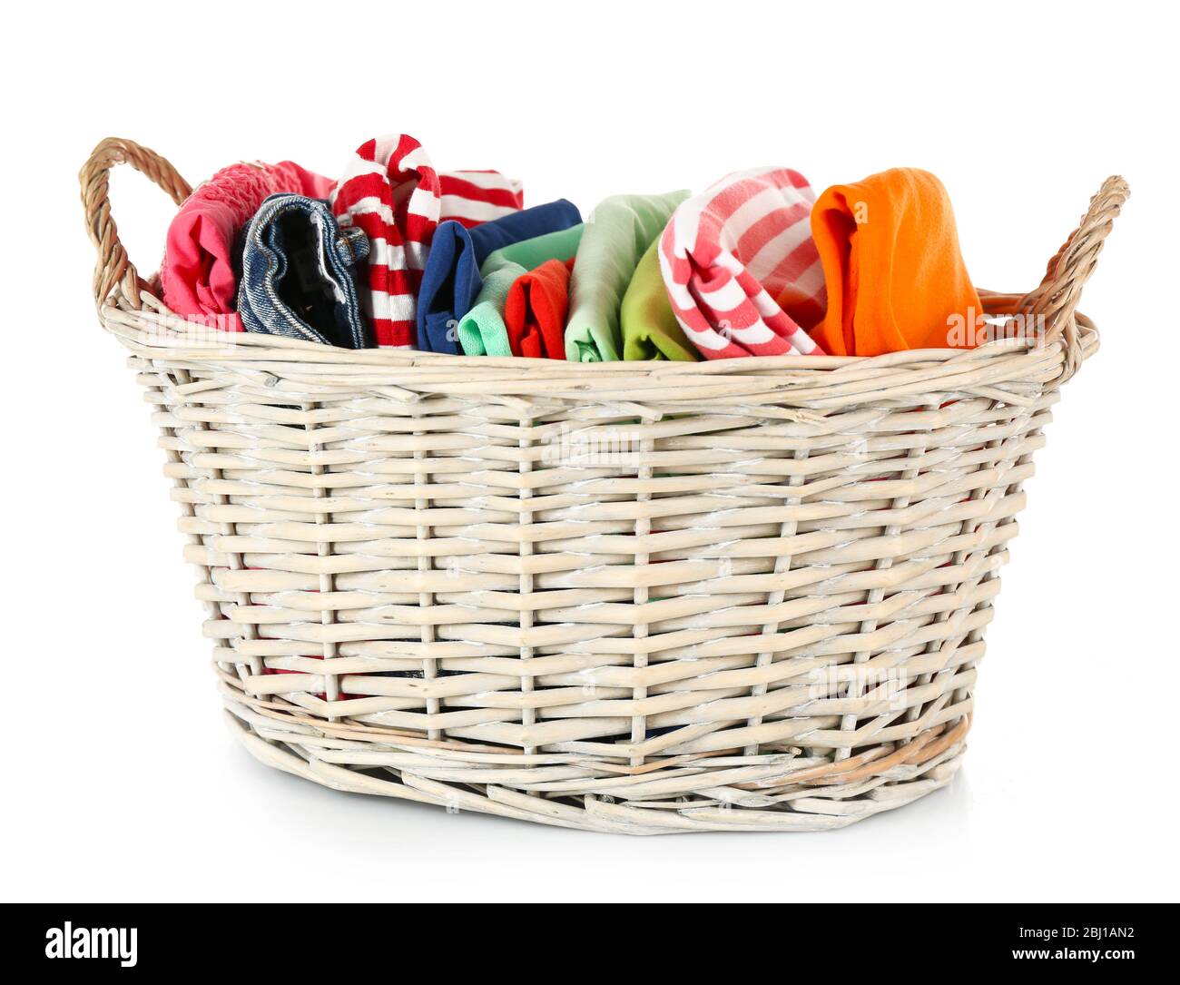 Colorful clothing in wicker basket isolated on white Stock Photo