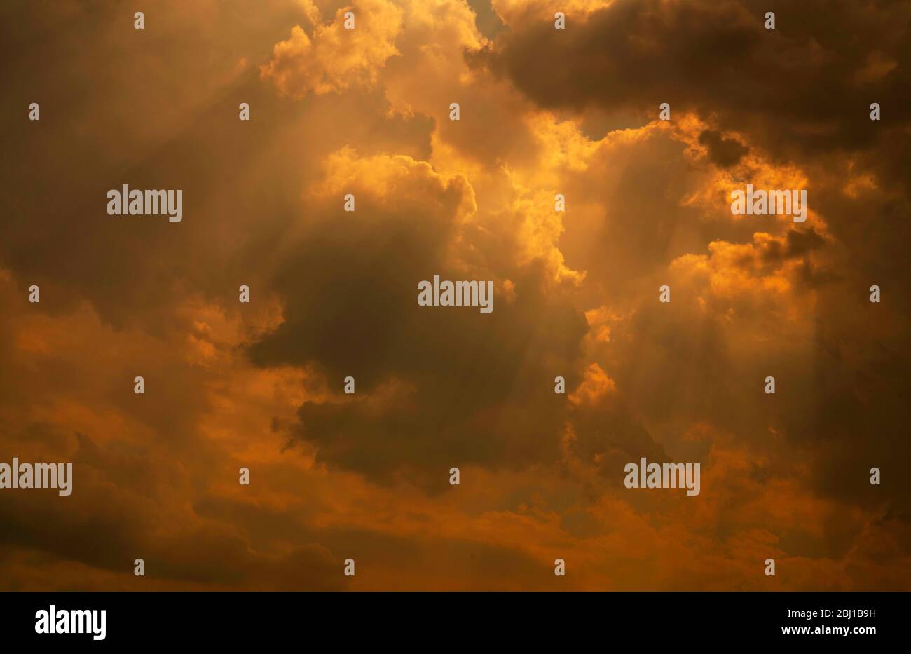 God light. White and golden cloudy sky with sun beam. Sun rays through golden clouds. God light from heaven for hope and faithful concept. Believe Stock Photo