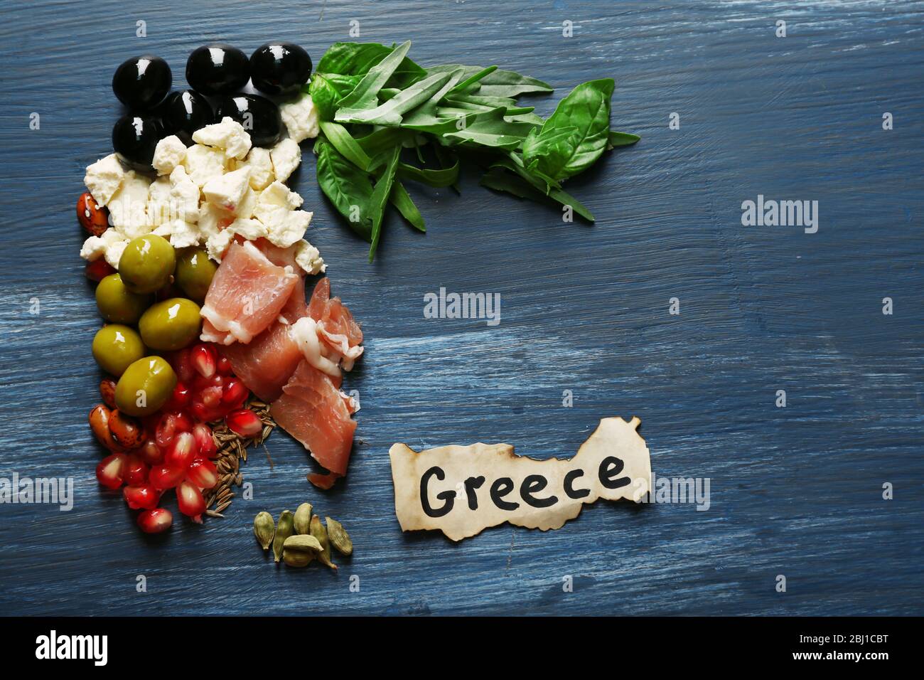 Map of Greece made with ingredients of traditional Greek cuisine on