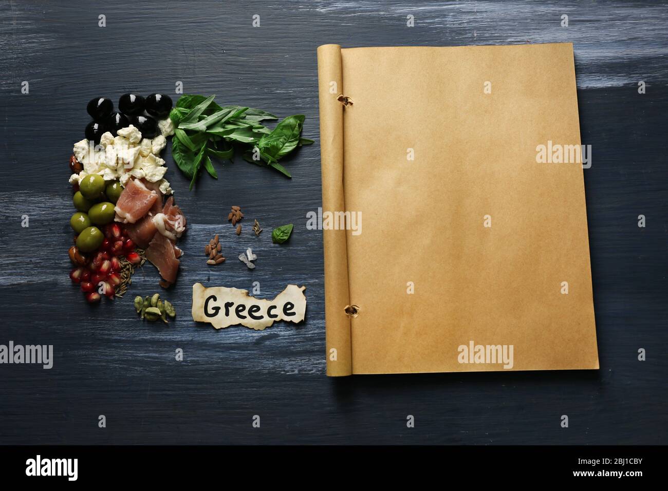 Map of Greece made with ingredients of traditional Greek cuisine on