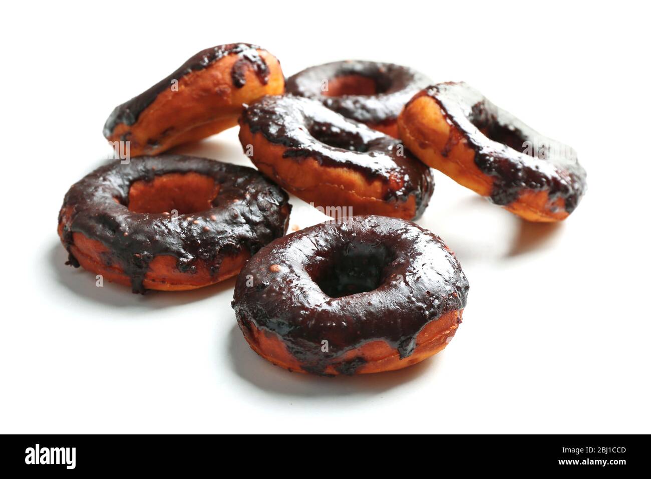 Delicious doughnuts with chocolate icing isolated on white Stock Photo ...
