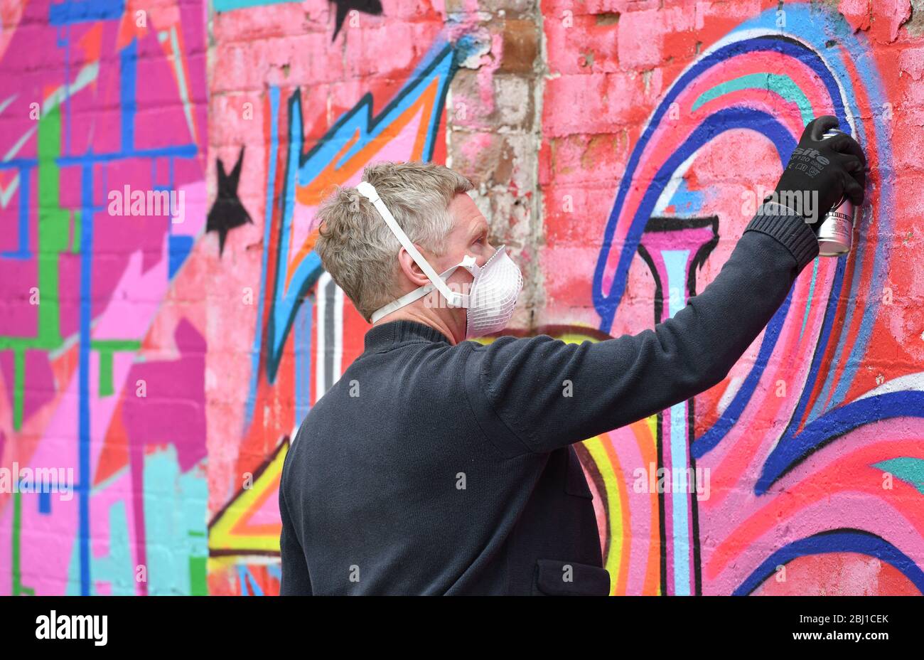 Graffiti artists working in the Digbeth area of Birmingham, England, UK