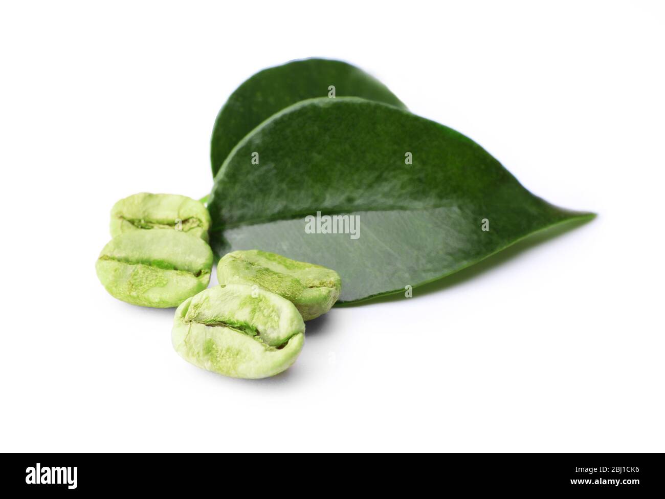 Green coffee beans with leaves isolated on white Stock Photo - Alamy