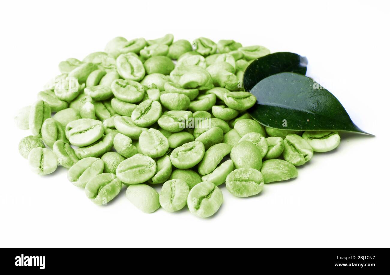 Green coffee beans with leaves isolated on white Stock Photo - Alamy