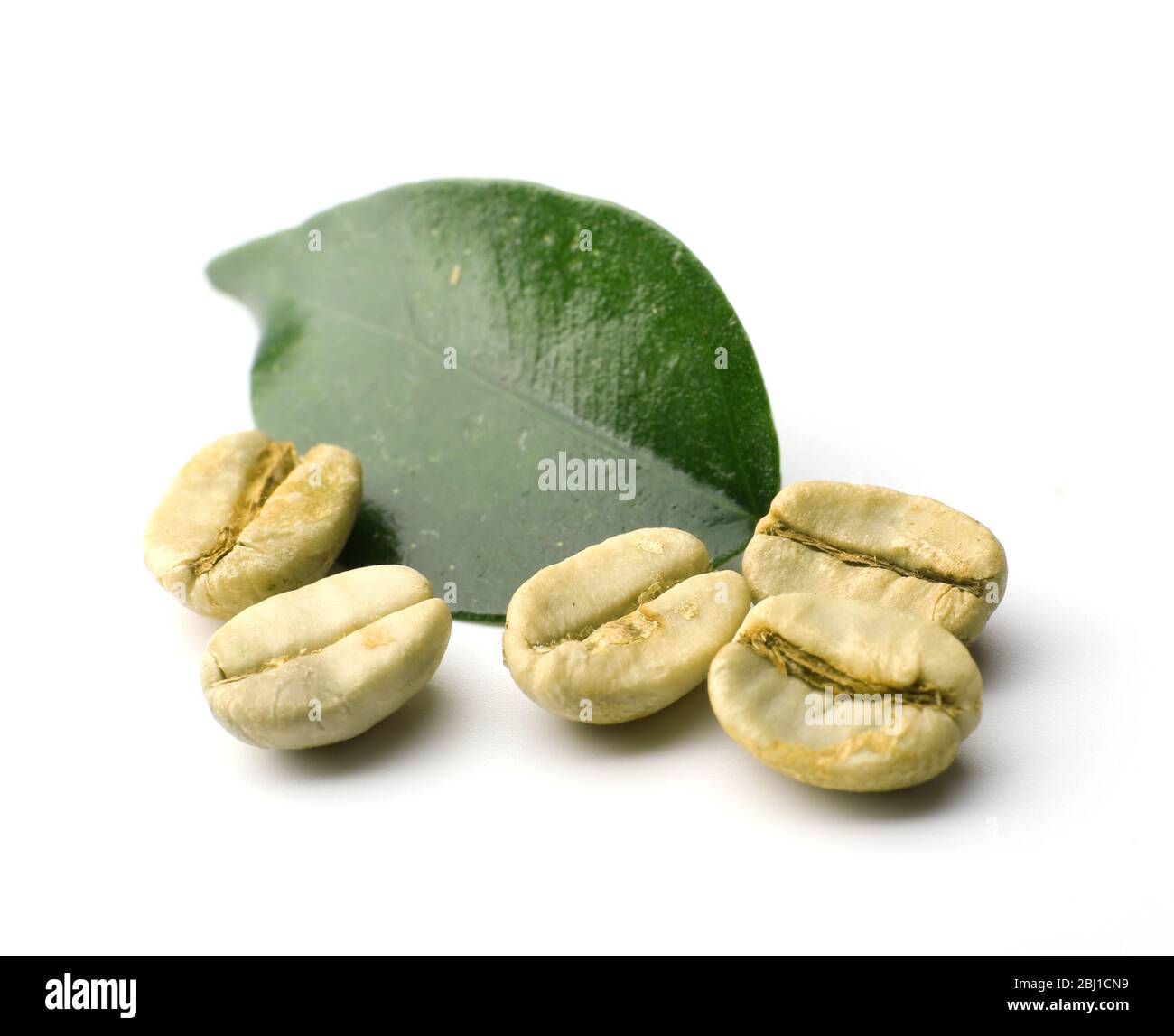 Green coffee beans with leaf isolated on white Stock Photo - Alamy
