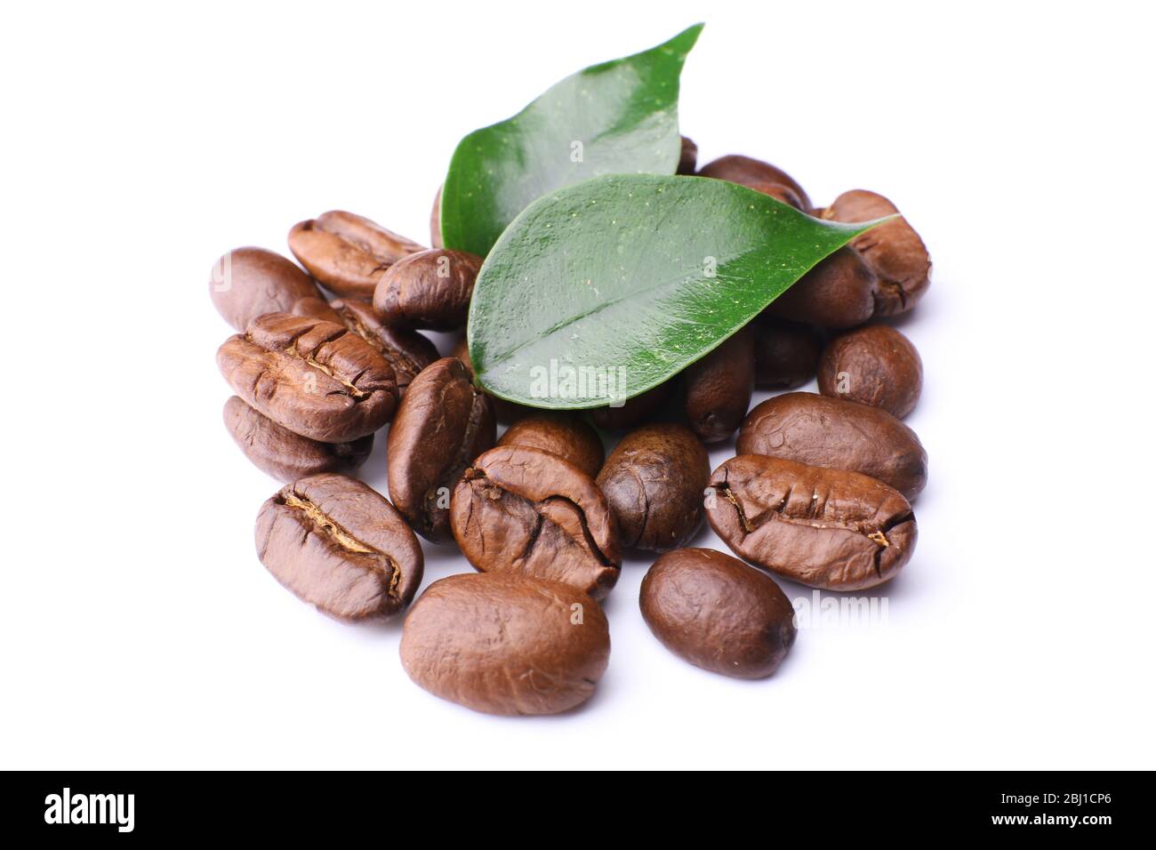 Coffee beans with leaves isolated on white Stock Photo - Alamy