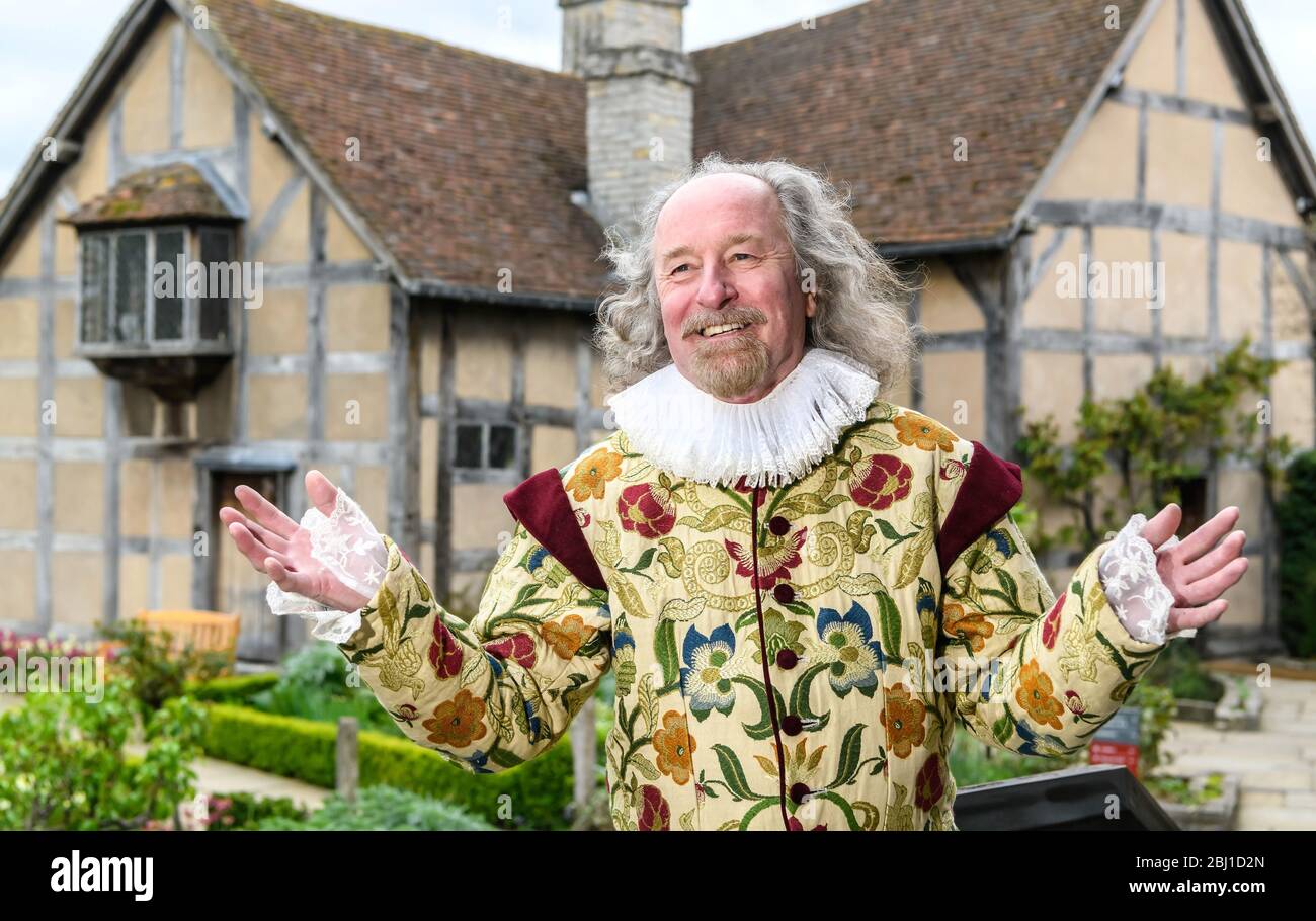 An actor portrays William Shakespeare outside Shakespeare's birthplace in StratforduponAvon