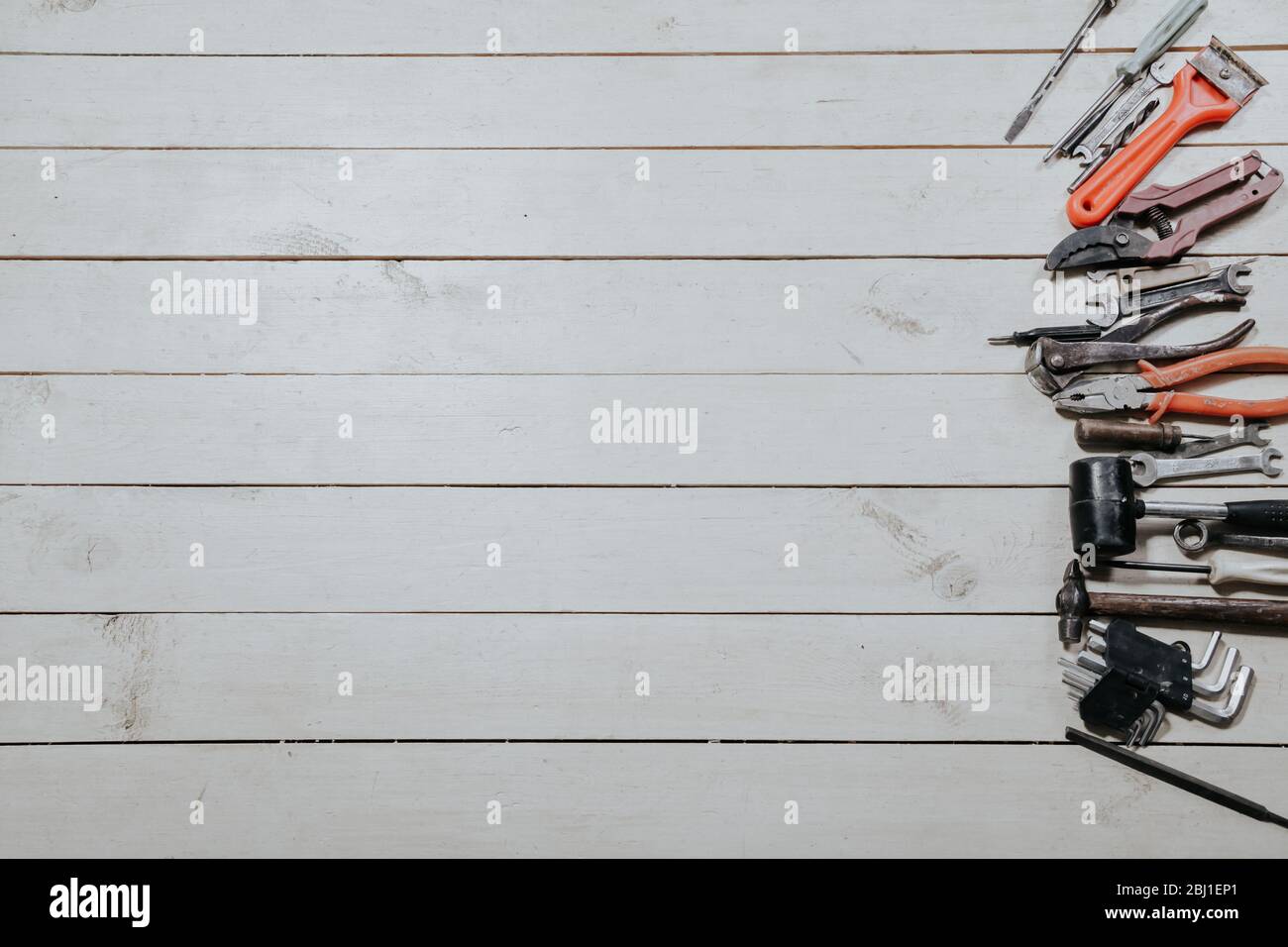 tools for repairs lies on the white boards Stock Photo