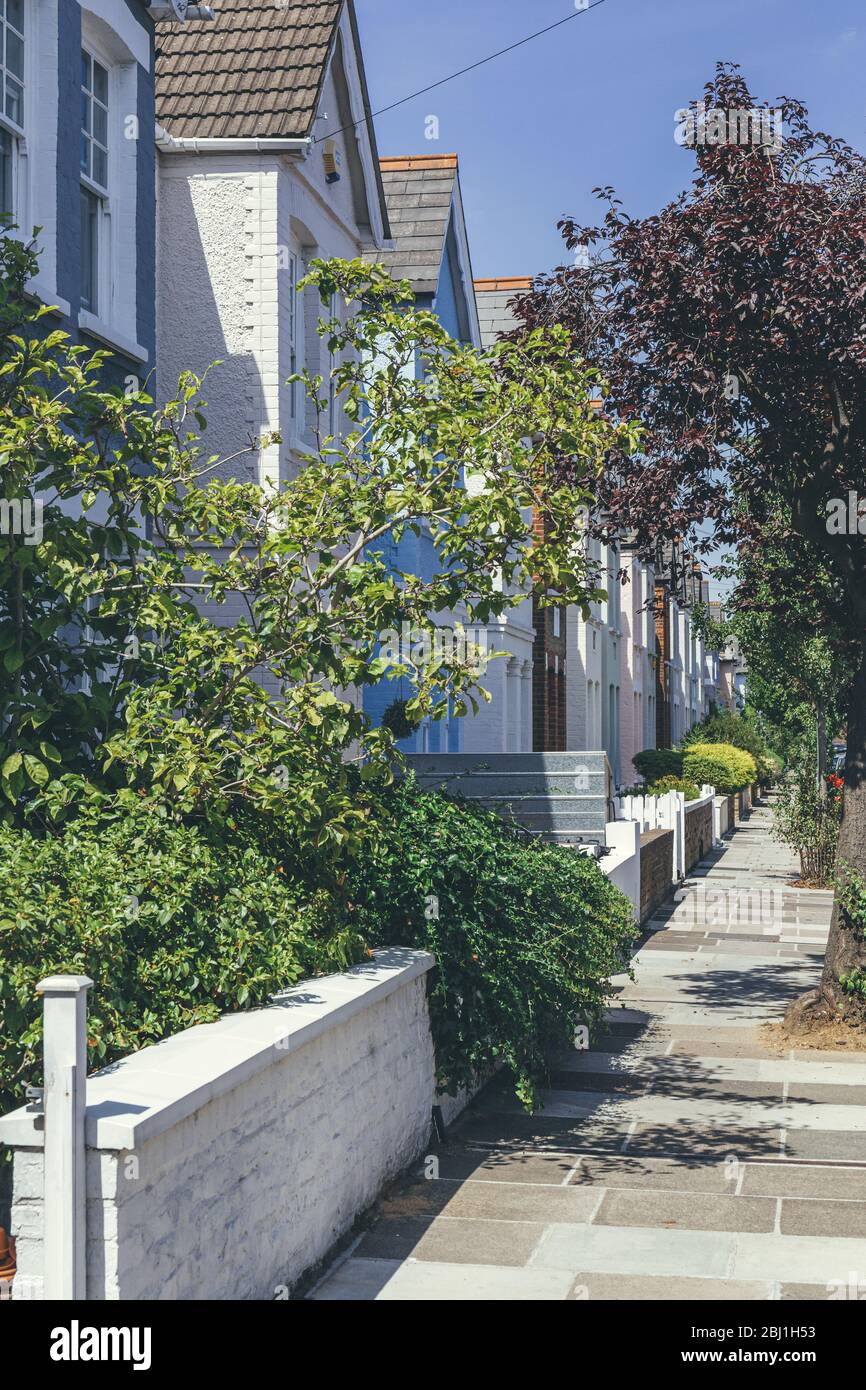 Pastelcolored terraced houses on White Hart Lane in Barnes. Terrace