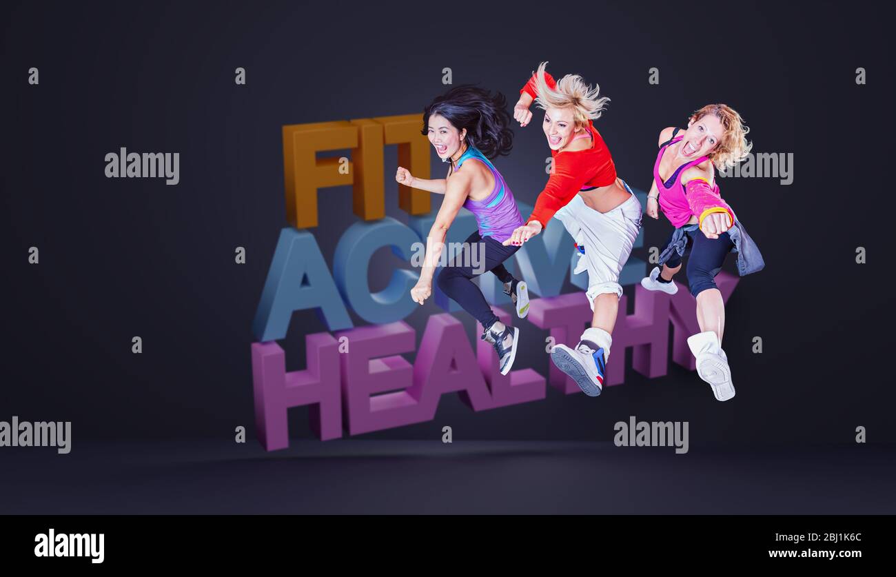 female fitness instructors in sport dress at an aerobic or zumba exercise Stock Photo