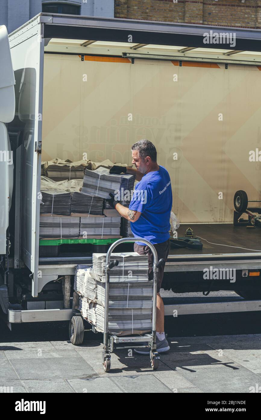 London/UK-1/08/18: man unloading the London Evening Standard at The Quadrant in Richmond. The Evening Standard is a local, free daily newspaper, publi Stock Photo