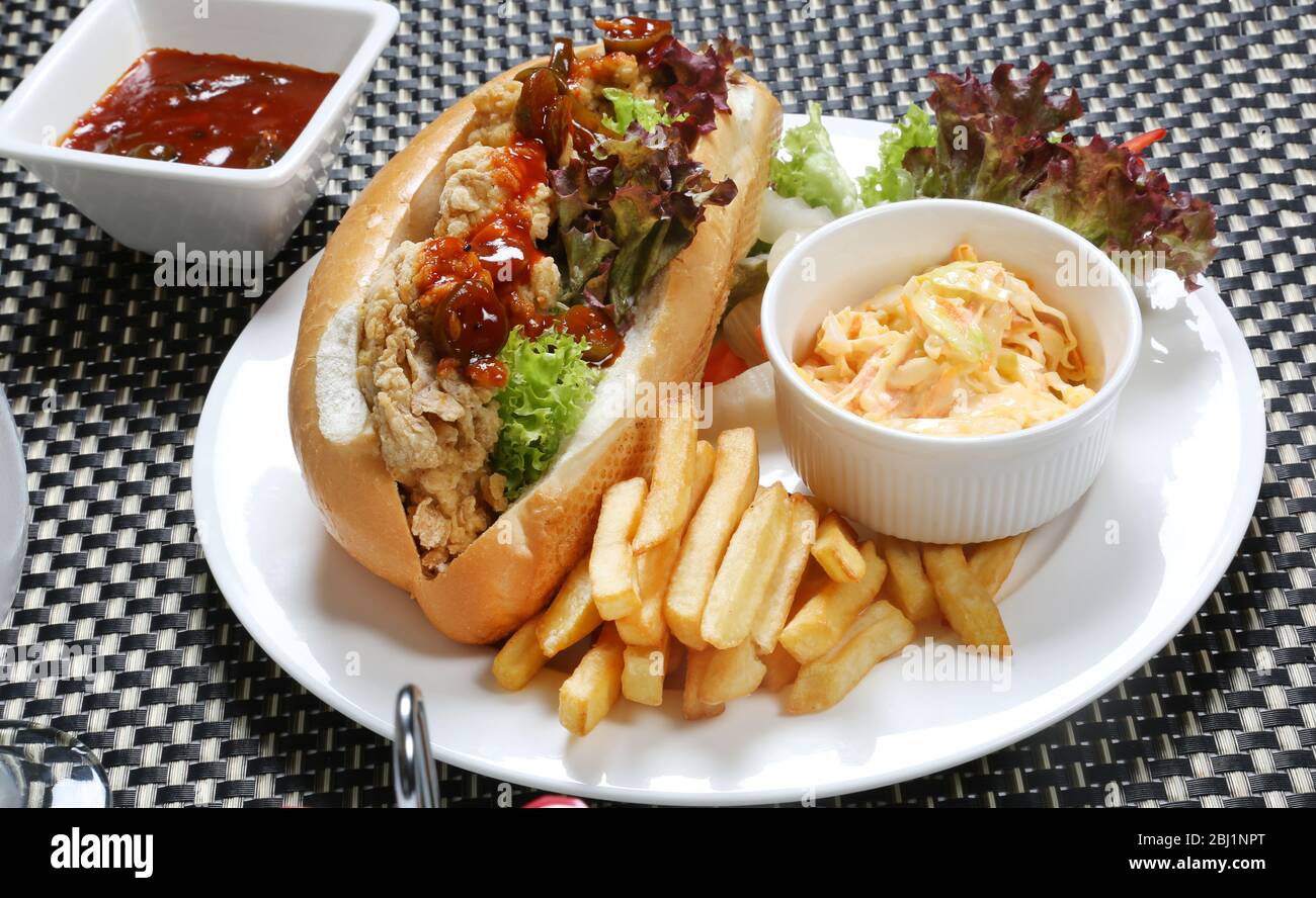 Zinger Chicken Sandwich with Coleslaw and Potato Fries Stock Photo