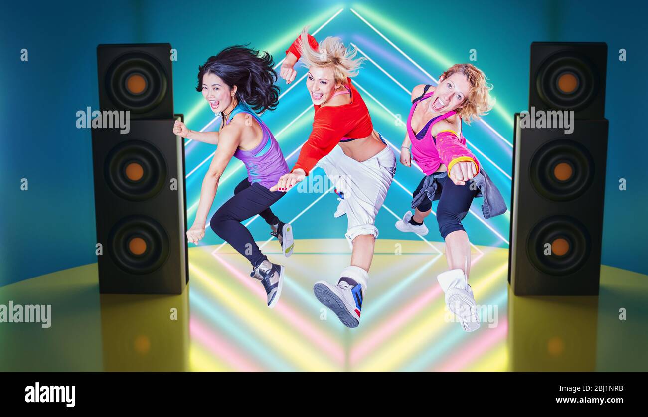 female fitness instructors in sport dress at an aerobic or zumba exercise Stock Photo