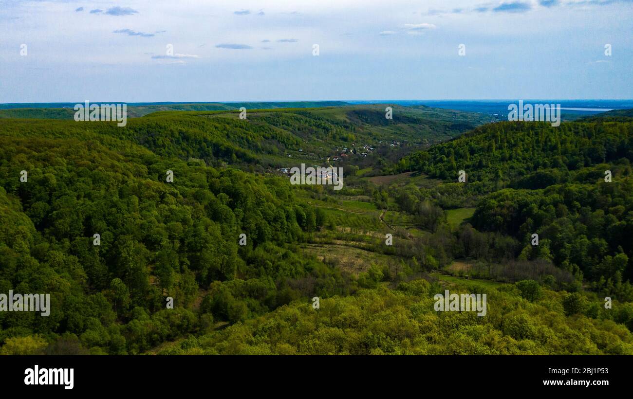 Aerial View of drone flying over the green forest Stock Photo - Alamy