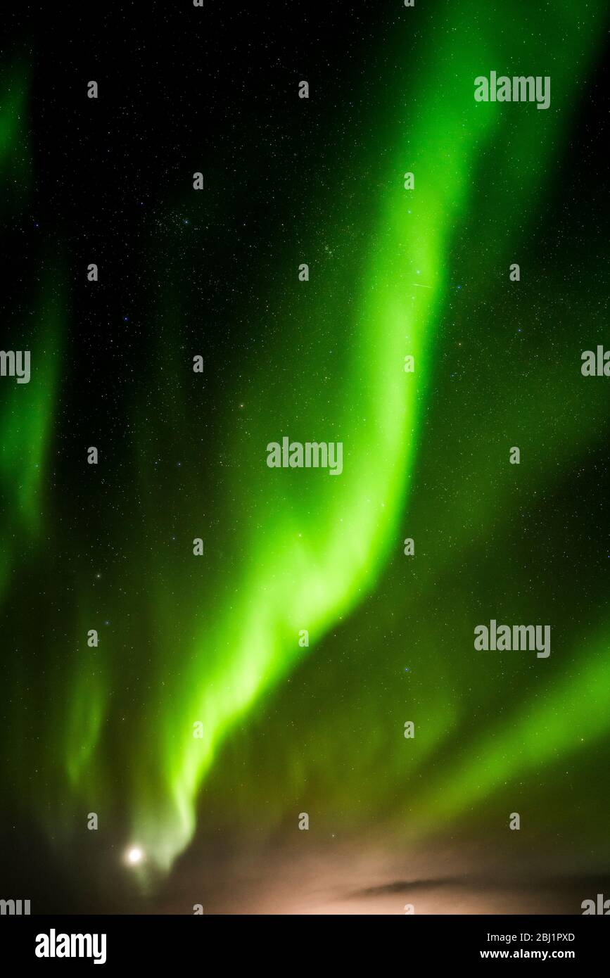 Green Aurora borealis streamers, northern Iceland  on the shores of Lake Myvatn Stock Photo