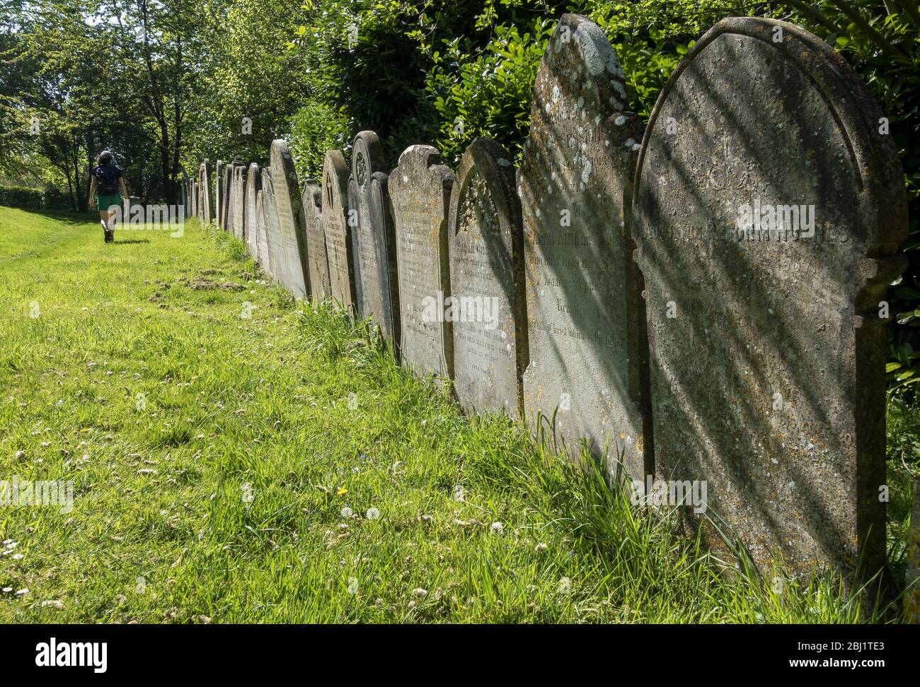 Gravestones in the grounds of St Mary the Virgin church in Micheldever, Hampshire, England, UK Stock Photo