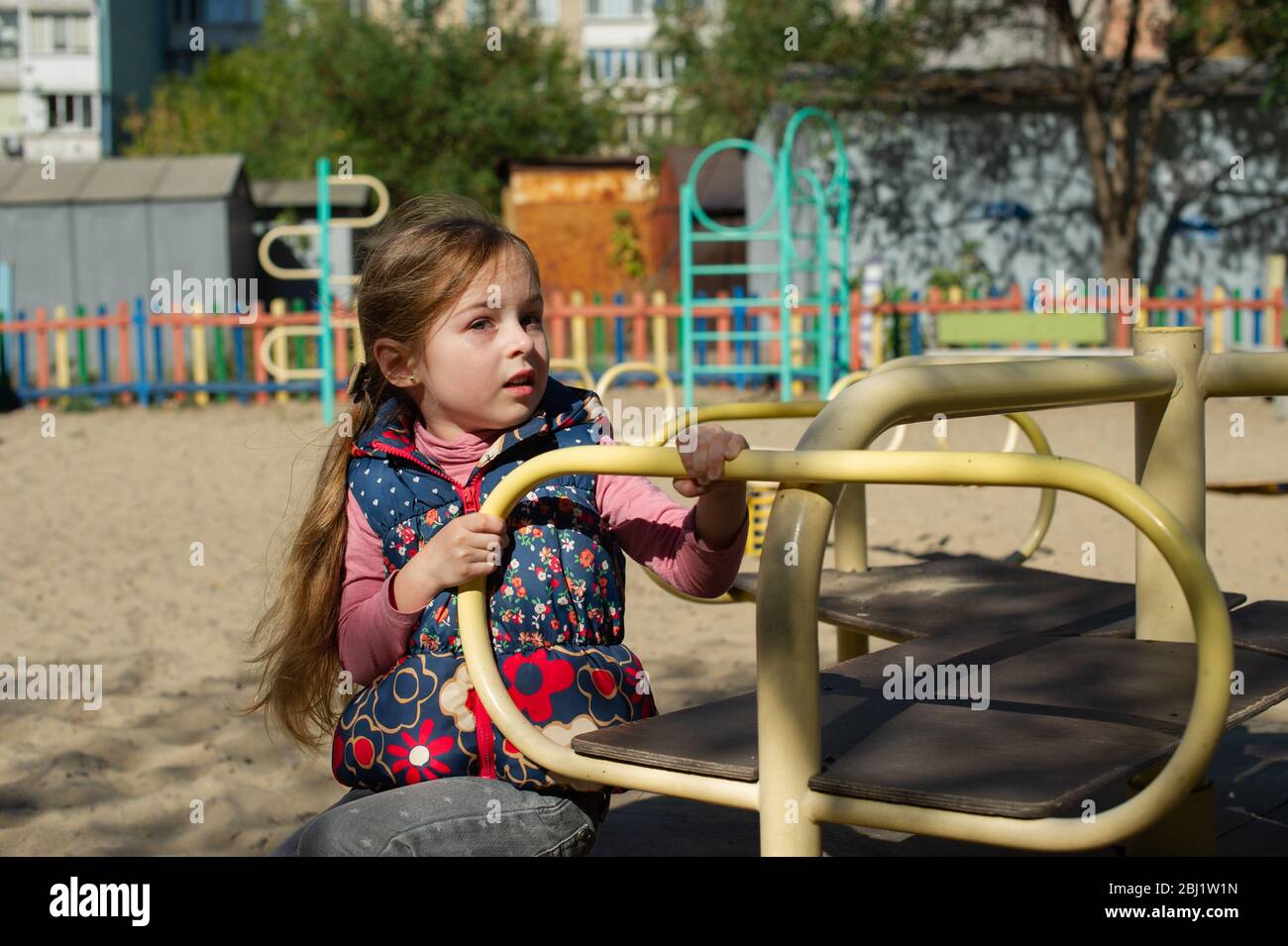 cute beautiful little girl on a playground Stock Photo - Alamy