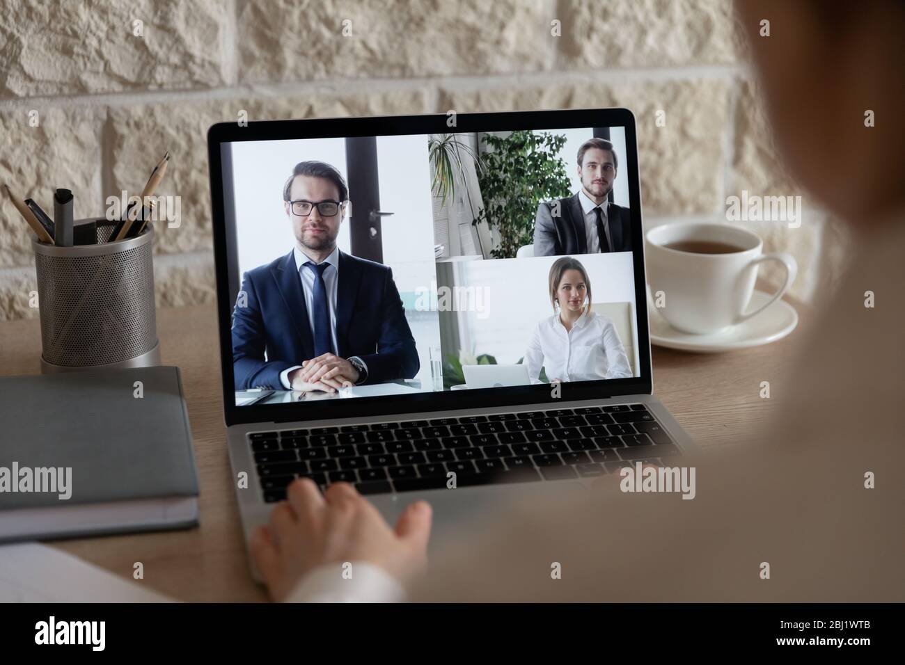 Businesspeople have webcam conference using laptop gadget Stock Photo