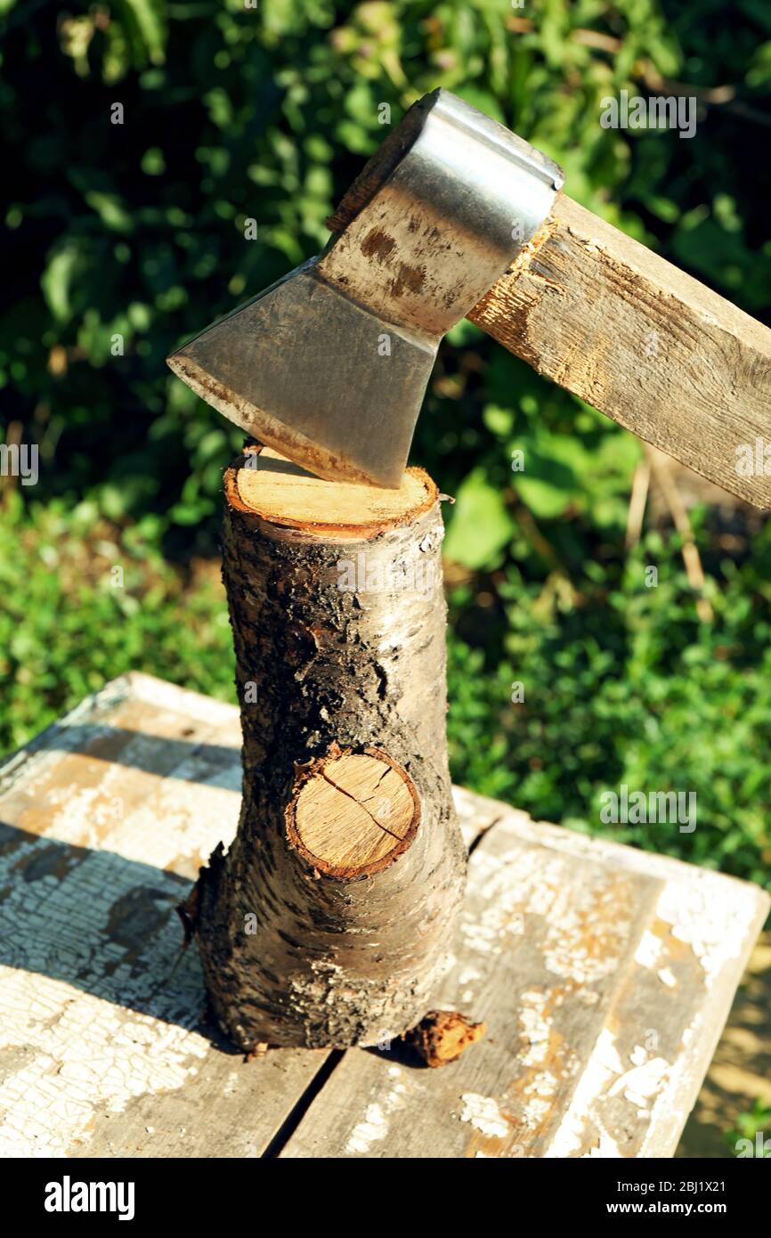 Firewood with hatchet outdoors Stock Photo Alamy