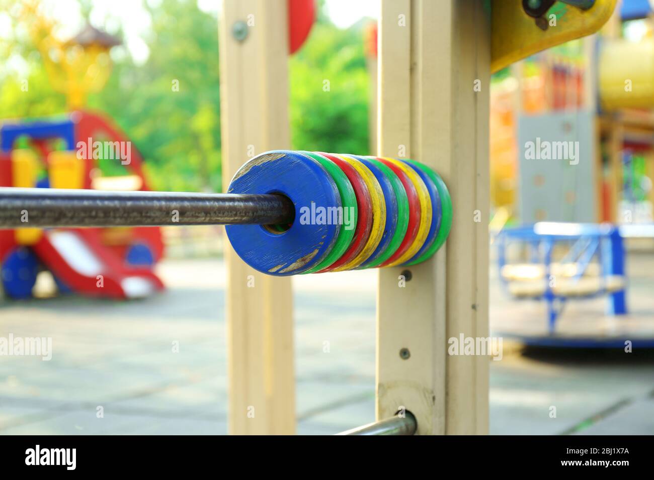 Colorful wooden rings for counting on children playground in park Stock ...
