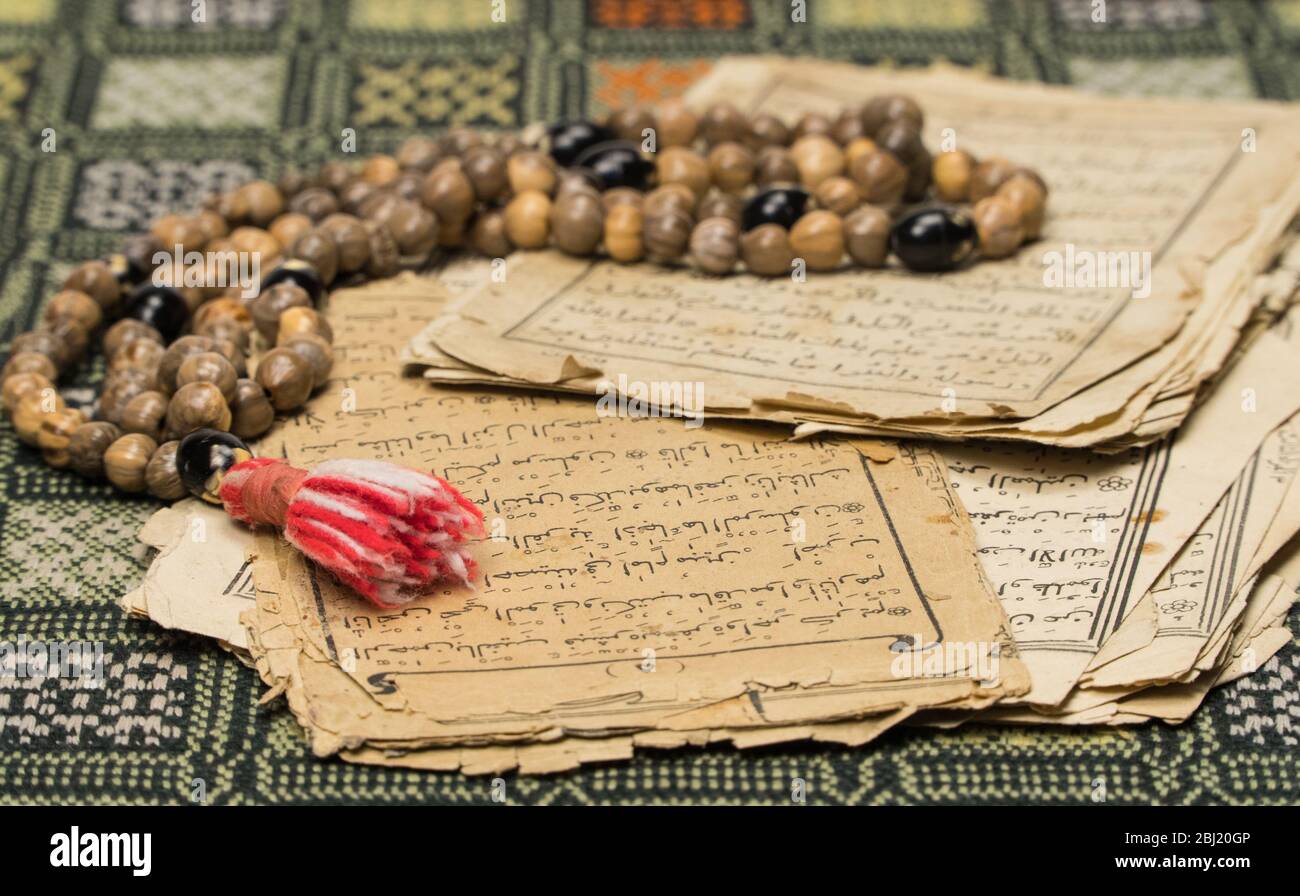 Muslim Paper Muslim prayer beads with ancient pages from the Koran. Islamic and ...