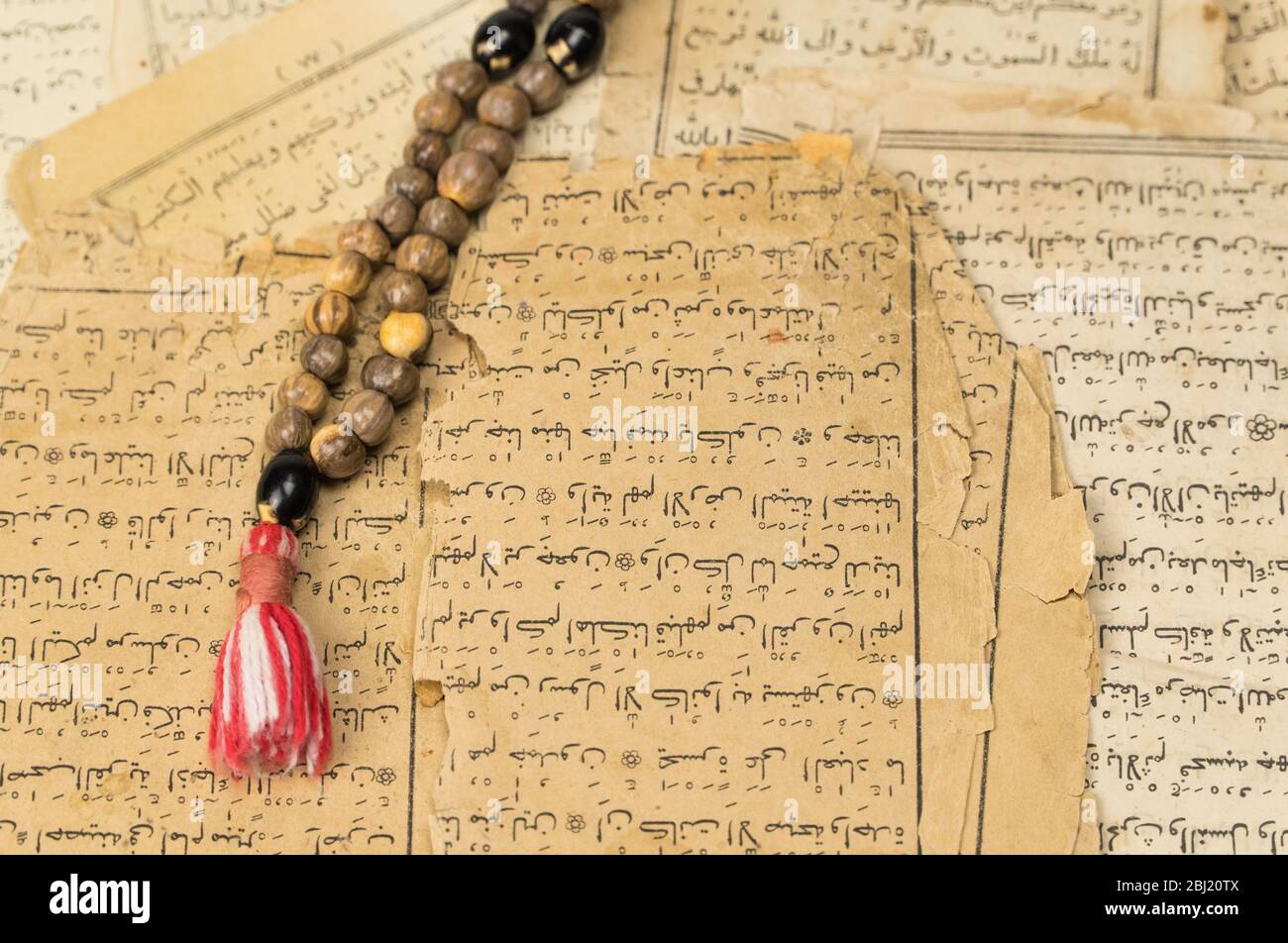 Muslim prayer beads with ancient pages from the Koran. Islamic and