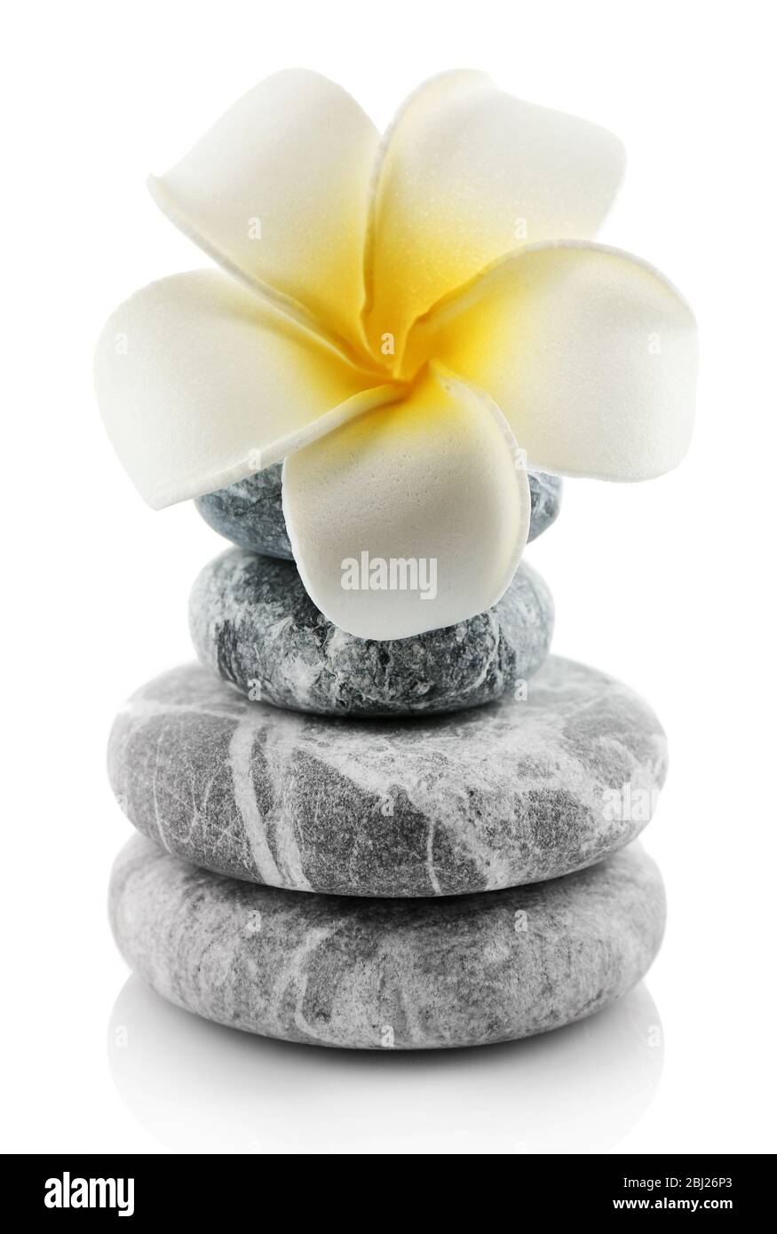 Stack of spa stones isolated on white Stock Photo - Alamy