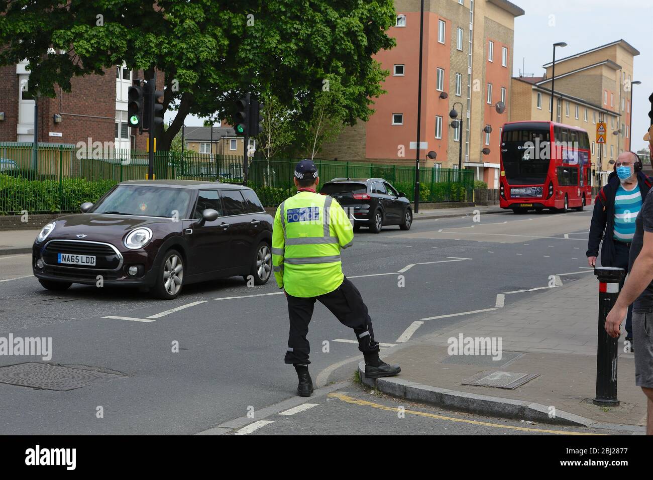 Traffic Police in London enforcing speeding restrictions in a 20 mph zone. Since same period last year there has been a 230% increase in speeding. Stock Photo