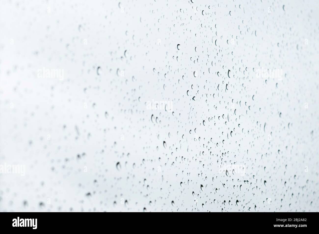 Raindrops on a window pane Stock Photo